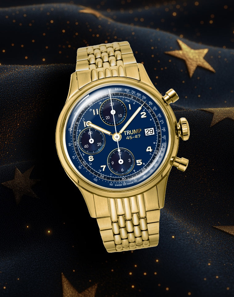 Gold Trump wristwatch with blue chronograph dial on star-patterned dark fabric background.