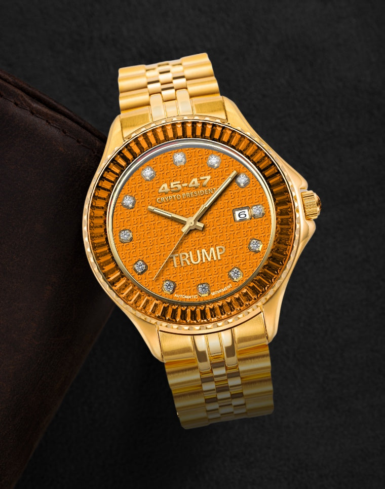 Gold wristwatch with orange face, diamond hour markers, and "TRUMP" and "Crypto President" text.