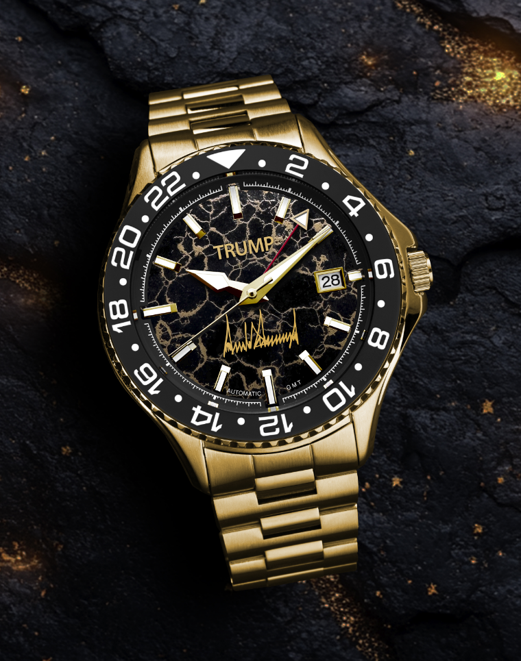 Gold Trump-branded wristwatch with black marble dial, date display, and gold metal band.