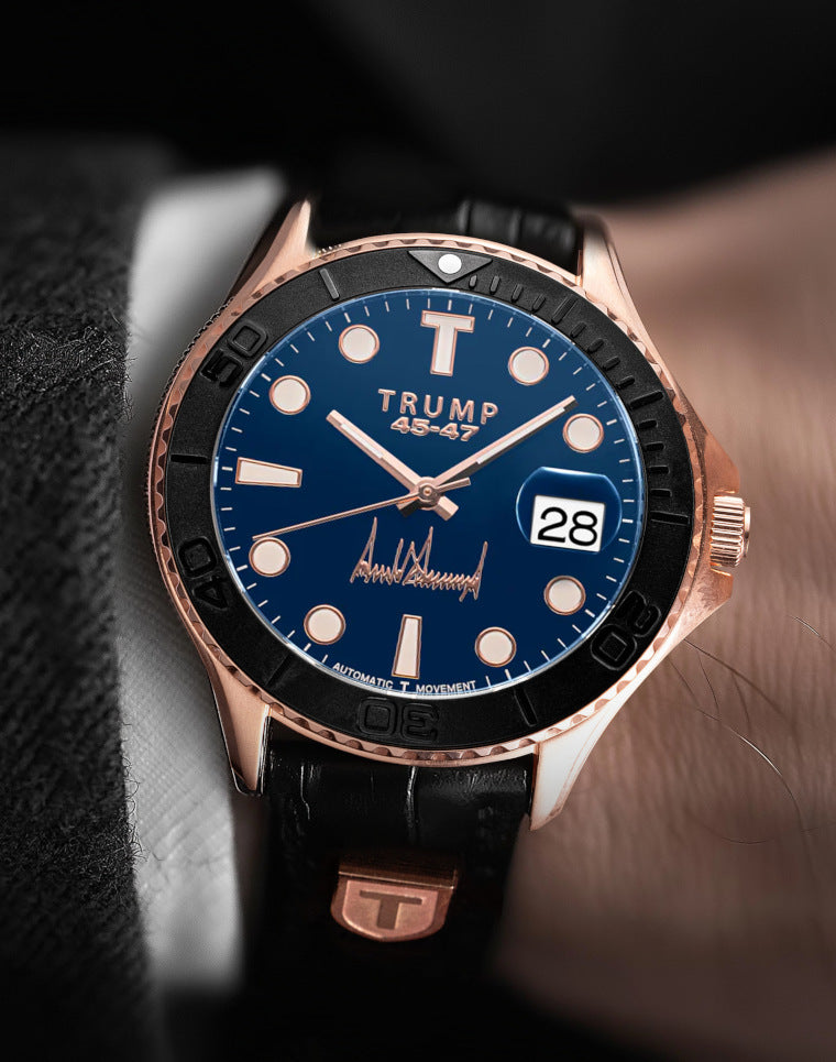 Rose gold Trump 45-47 watch with blue dial, black bezel, leather strap, and date display.
