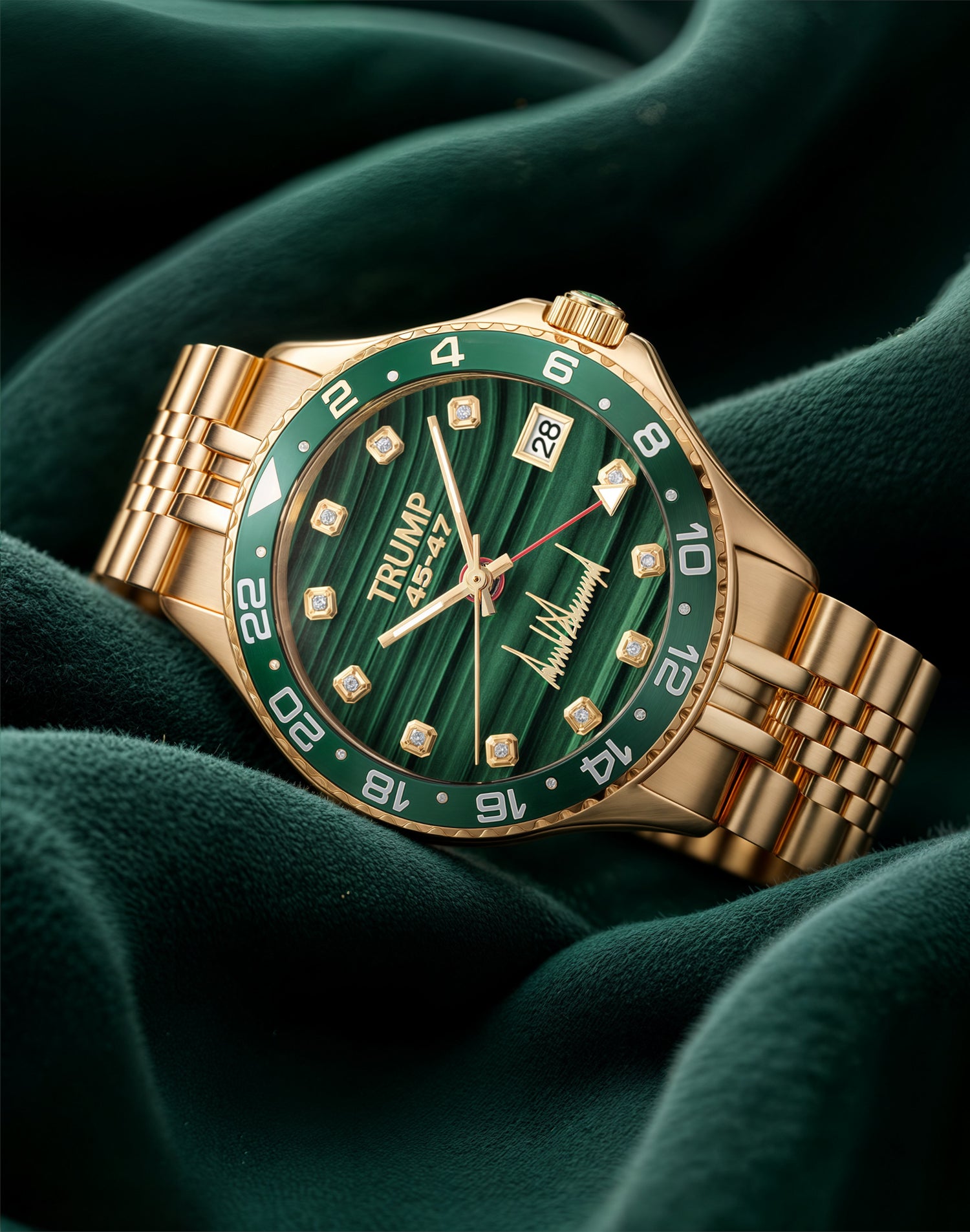 Gold wristwatch with green dial, diamond markers, and "TRUMP 45-47" engraving on velvet fabric.