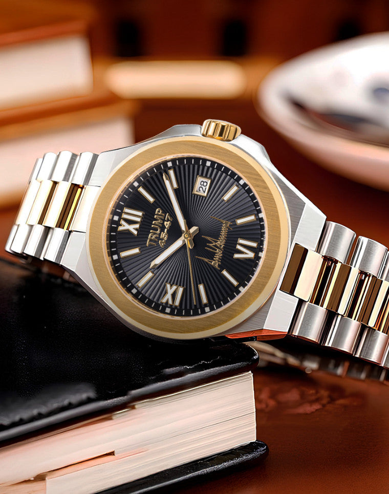Two-tone Trump 45:47 wristwatch with black dial, gold bezel, and Roman numerals on book.