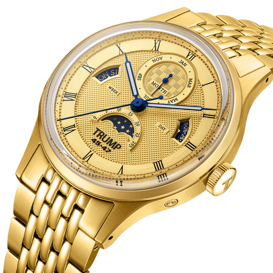 Gold wristwatch with detailed face on a white background